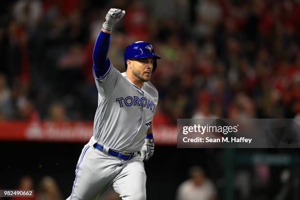 Steve Pearce of the Toronto Blue Jays reacts after hitting a three-run homerun during the ninth inning of a game against the Los Angeles Angels of...