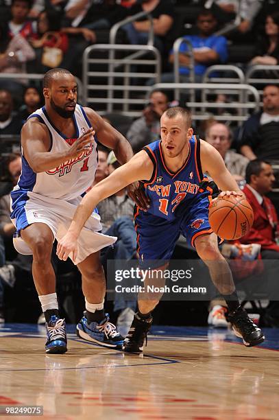 Sergio Rodriguez of the New York Knicks dribbles against Baron Davis of the Los Angeles Clippers at Staples Center on April 4, 2010 in Los Angeles,...