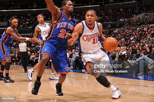 Eric Gordon of the Los Angeles Clippers drives along the baseline past Toney Douglas of the New York Knicks at Staples Center on April 4, 2010 in Los...