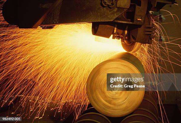 steel roll producing sparks - steel plant stock pictures, royalty-free photos & images