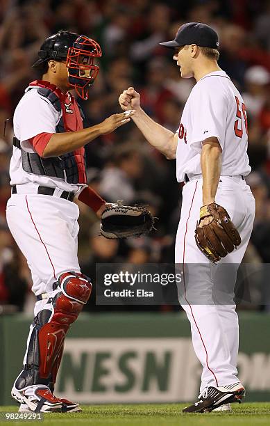 Jonathan Papelbon and Victor Martinez of the Boston Red Sox celebrate the win over the New York Yankees on April 4, 2010 during Opening Night at...