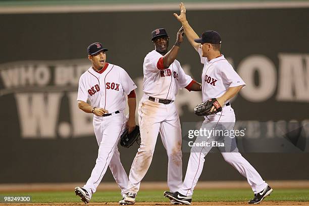 Jacoby Ellsbury,Mike Cameron and J.D. Drew of the Boston Red Sox celebrate the win over the New York Yankees on April 4, 2010 during Opening Night at...