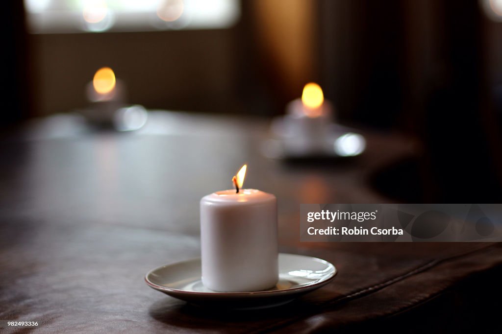 Candle on a Piano