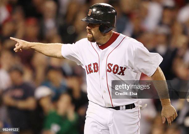 Kevin Youkilis of the Boston Red Sox celebrates his run against the New York Yankees on April 4, 2010 during Opening Night at Fenway Park in Boston,...