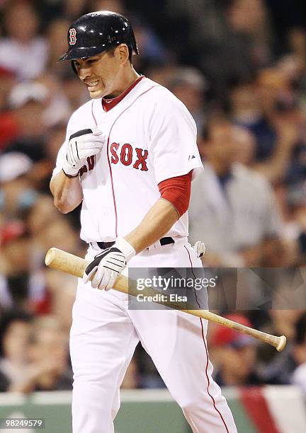 Jacoby Ellsbury of the Boston Red Sox heads into the dugout after he struck out against the New York Yankees on April 4, 2010 during Opening Night at...