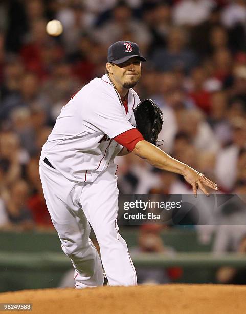 Josh Beckett of the Boston Red Sox sends the ball to first to get Alex Rodriguez of the New York Yankees out on April 4, 2010 during Opening Night at...