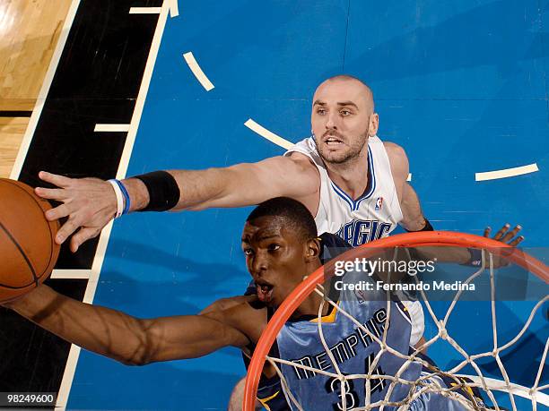 Hasheem Thabeet of the Memphis Grizzlies competes for a rebound against Marcin Gortat of the Orlando Magic during the game on April 4, 2010 at Amway...