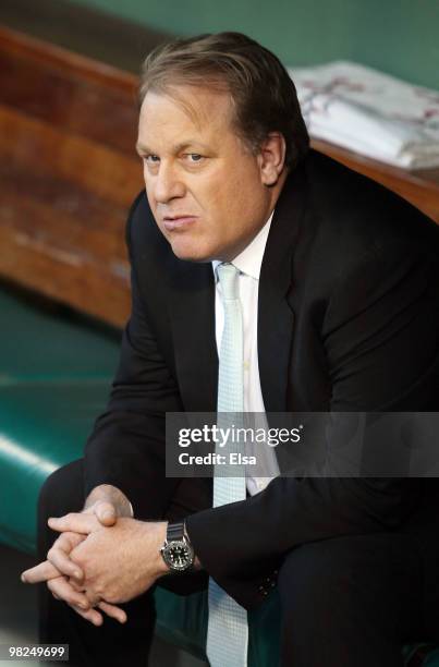 Former Boston Red Sox pitcher Curt Schilling sits in the dugout before the home opener against the New York Yankees on April 4, 2010 during Opening...