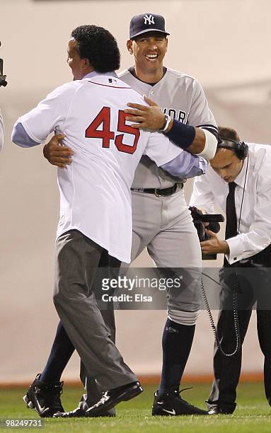 Alex Rodriguez of the New York Yankees hugs former Boston Red Sox pitcher Pedro Martinez before the game on April 4, 2010 during Opening Night at...