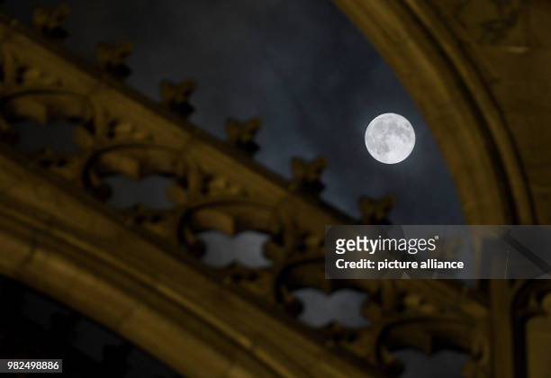 The full moon shines bright shortly after midnight, illuminating the Cathedral in Cologne, Germany, 1 February 2018. For the second time in a month...