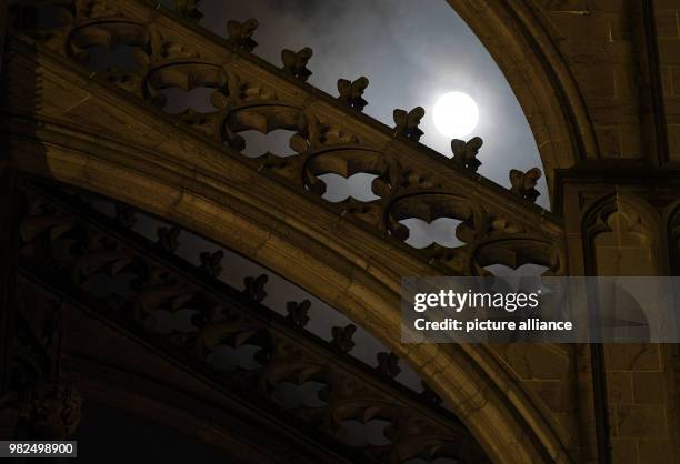 The full moon shines bright shortly after midnight, illuminating the Cathedral in Cologne, Germany, 1 February 2018. For the second time in a month...