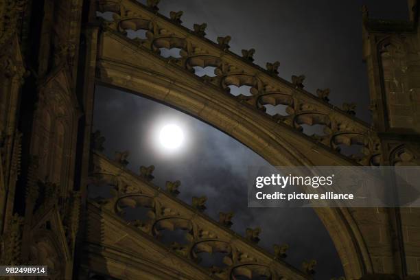 The full moon shines bright shortly after midnight, illuminating the Cathedral in Cologne, Germany, 1 February 2018. For the second time in a month...