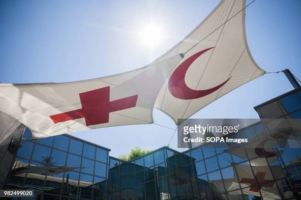 The International Red Cross and Red Crescent Movement flag seen at the ICRC museum in Geneva. Geneva is second largest city in Switzerland and it is...