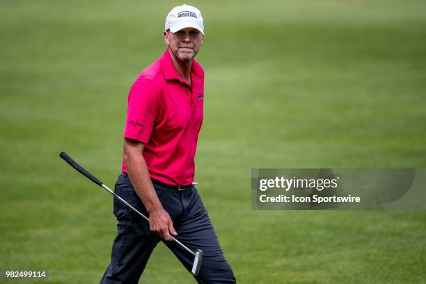 Steve Stricker walks up to the 18th green with his putter in hand to go for a birdie to close out his day during American Family Insurance...