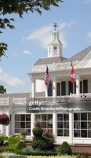 daytime view of a white house in frankenmuth, michigan. - saginaw michigan stock pictures, royalty-free photos & images