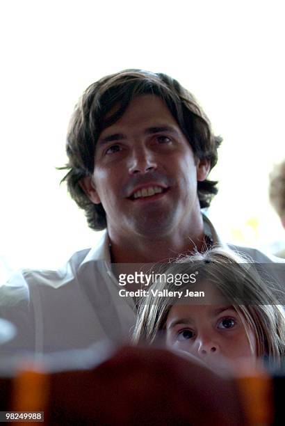 Daughter Aurora Figueras and her dad Ralph Lauren model and polo player Nacho Figueras attends match at Palm Beach International Polo Club on April...