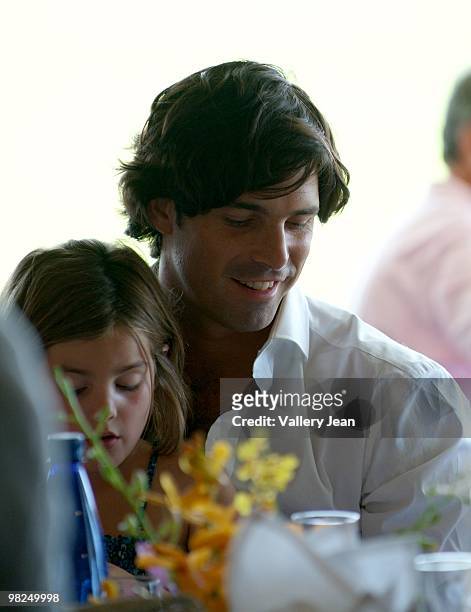 Daughter Aurora Figueras and her dad Ralph Lauren model and polo player Nacho Figueras attends match at Palm Beach International Polo Club on April...