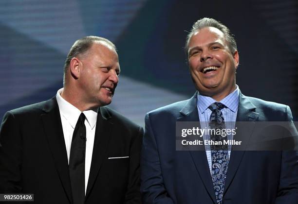 Head coach Gerard Gallant of the Vegas Golden Knights and general manager Kevin Cheveldayoff of the Winnipeg Jets share a laugh onstage before the...