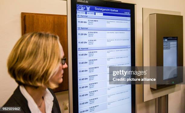 Judge Geelke Otten works on a touchscreen during the presentation of the digital court room in Itzehoe, Germany, 1 February 2018. The district court...