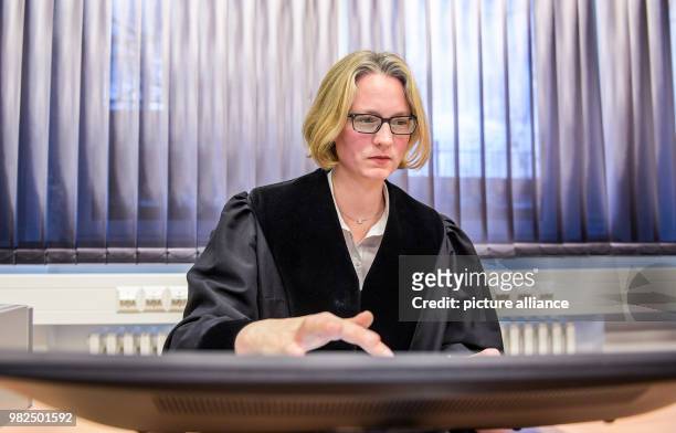 Judge Geelke Otten works on a touchscreen during the presentation of the digital court room in Itzehoe, Germany, 1 February 2018. The district court...