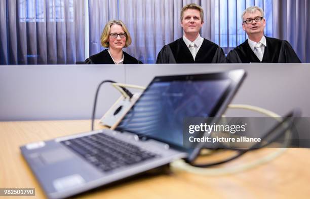 Judges Geelke Otten , Hendrik Jensen and Dominik Mardorf attend the presentation of the digital court room in Itzehoe, Germany, 01 February 2018. The...