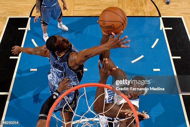 Brandon Bass of the Orlando Magic shoots against Darrell Arthur of the Memphis Grizzlies during the game on April 4, 2010 at Amway Arena in Orlando,...