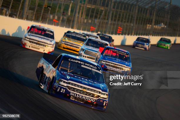 Johnny Sauter, driver of the ISM Connect Chevrolet, leads a pack of truck during the NASCAR Camping World Truck Series Villa Lighting delivers the...