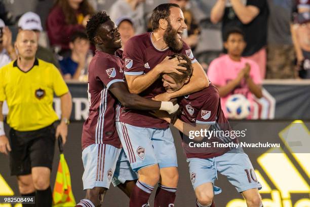 Dominique Badji and Shkelzen Gashi of Colorado Rapids celebrate with teammate Joe Mason after mason scores against Minnesota United at Dick's...