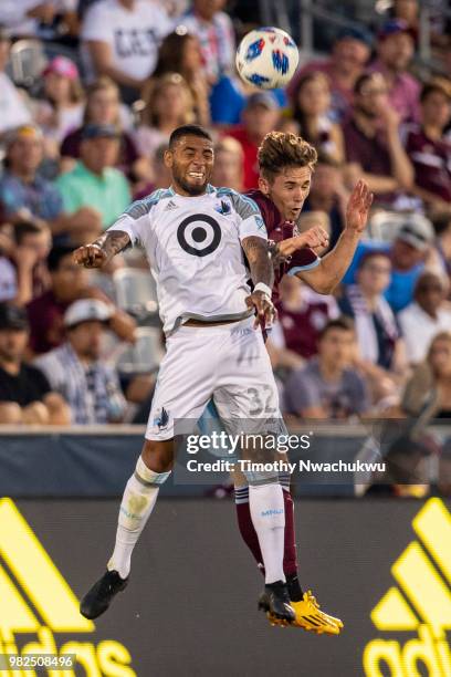 Alexi Gomez of Minnesota United and Sam Nicholson of Colorado Rapids reach for a header at Dick's Sporting Goods Park on June 23, 2018 in Commerce...