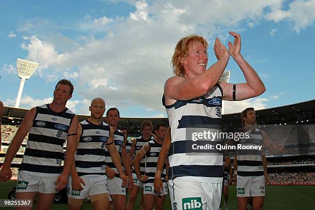 Cameron Ling of the Cats leads his players off the ground after winning the round two AFL match between the Hawthorn Hawks and the Geelong Cats at...