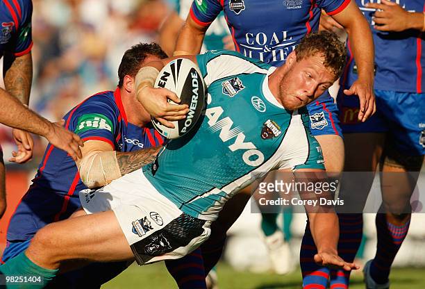 Nathan Smith of the Panthers is tackled during the round four NRL match between the Newcastle Knights and the Penrith Panthers at EnergyAustralia...