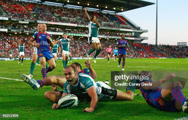 Adrian Purtell of the Panthers scores the winning try during the round four NRL match between the Newcastle Knights and the Penrith Panthers at...