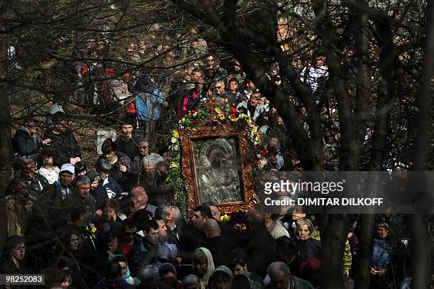 Bulgarian Orthodox pilgrims carry an icon of the Virgin Mary during an annual religious march marking the second day of Easter at the Bachkovo...