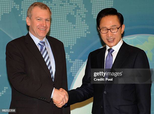 Belgian Prime Minister Yves Leterme shakes hands with South Korean President Lee Myung-Bak before their summit at presidential house on April 5, 2010...