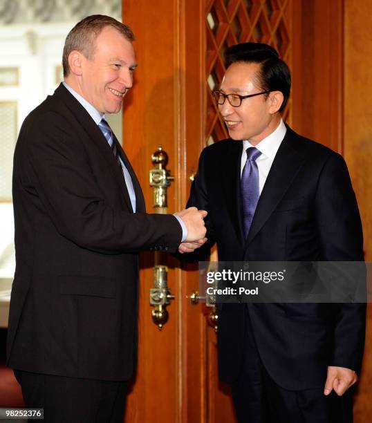 Belgian Prime Minister Yves Leterme shakes hands with South Korean President Lee Myung-Bak before their summit at presidential house on April 5, 2010...