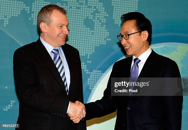 Belgian Prime Minister Yves Leterme shakes hands with South Korean President Lee Myung-Bak before their summit at presidential house on April 5, 2010...