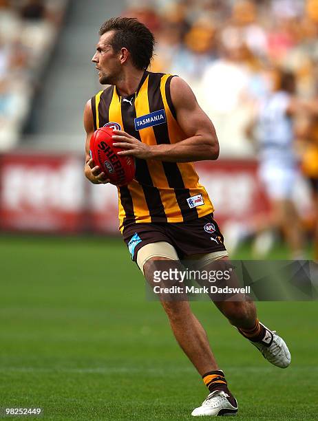 Luke Hodge of the Hawks looks for a teammate during the round two AFL match between the Hawthorn Hawks and the Geelong Cats at Melbourne Cricket...