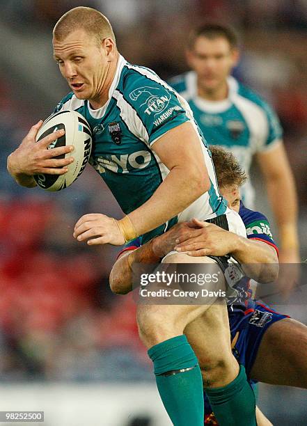 Luke Lewis of the Panthers is tackled during the round four NRL match between the Newcastle Knights and the Penrith Panthers at EnergyAustralia...