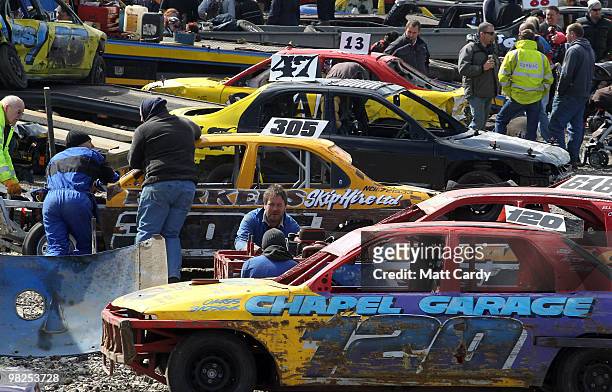 Banger racers work on their cars that have just finished a heat at the United Downs Raceway in St Day near Redruth on April 4, 2010 in Cornwall,...