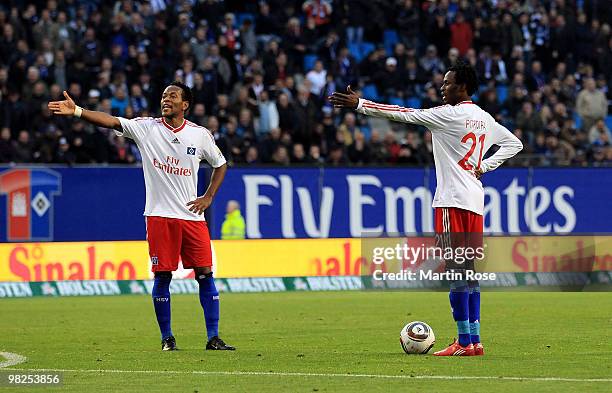 Ze Roberto and Jonathan Pitroipa of Hamburg gestures during the Bundesliga match between Hamburger SV and Hannover 96 at HSH Nordbank Arena on April...