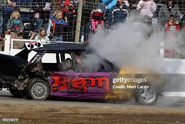 Car steams as it competes in the 2-litre National Bangers Heat race at the United Downs Raceway banger racing meet in St Day near Redruth on April 4,...