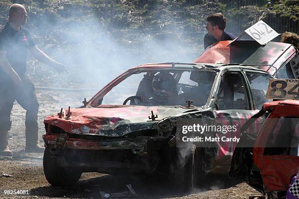 Mechanics try to get a car ready for another heat at the United Downs Raceway banger racing meet in St Day near Redruth on April 4, 2010 in Cornwall,...