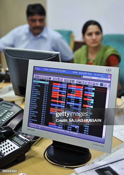 Indian stock traders trade at a brokerage firm in Mumbai on April 5, 2010. Indian shares rose 1.37 percent on Monday, an over two-year-high, on...