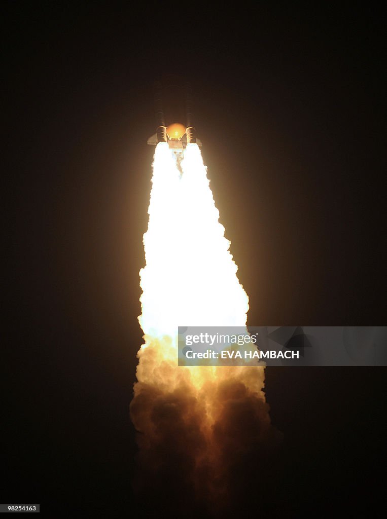 The space shuttle Discovery lifts off fr