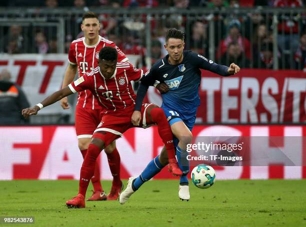 David Alaba of Muenchen and Mark Uth of Hoffenheim battle for the ball during the Bundesliga match between FC Bayern Muenchen and TSG 1899 Hoffenheim...