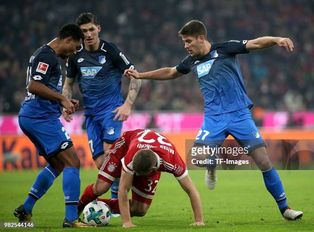 Serge Gnabry of Hoffenheim, Steven Zuber of Hoffenheim, Joshua Kimmich of Muenchen and Andrej Kramaric of Hoffenheim battle for the ball during the...