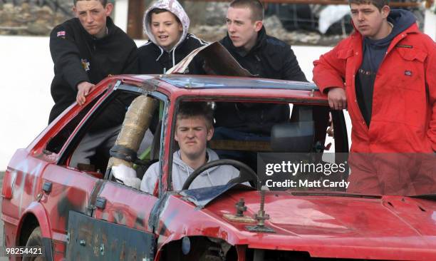 Banger racers, with their friends and family parade their cars before the first heat of the 2-litre National Bangers race at the United Downs Raceway...