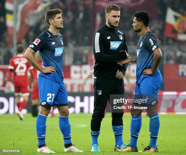 Andrej Kramaric of Hoffenheim, Ermin Bicakcic of Hoffenheim and Serge Gnabry of Hoffenheim look dejected after the Bundesliga match between FC Bayern...