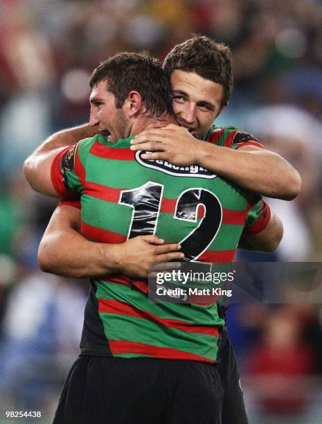 David Taylor and Sam Burgess of the Rabbitohs celebrate at fulltime during the round four NRL match between the South Sydney Rabbitohs and the...