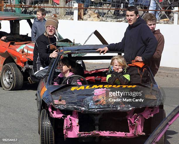 Banger racers, with their friends and family parade their cars before the first heat of the 2-litre National Bangers race at the United Downs Raceway...